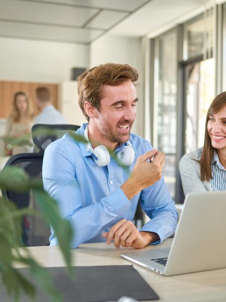 Two people in start up office, working together